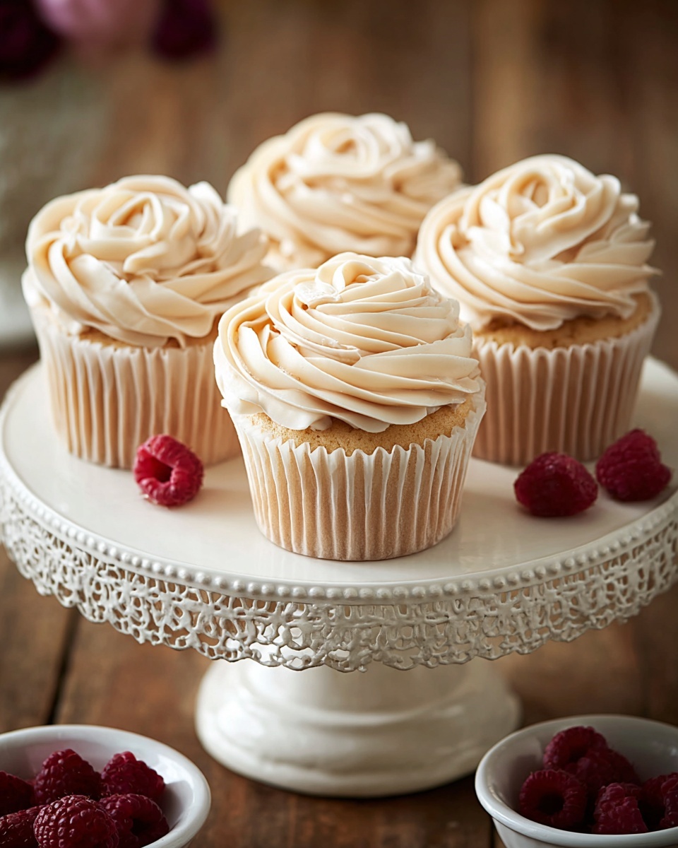Almond Wedding Cake Cupcakes with Raspberry Filling Recipe - Recipe Image